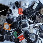 an assortment of old electronics in a pile