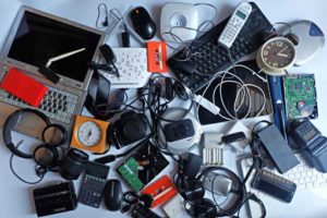 an assortment of old electronics in a pile